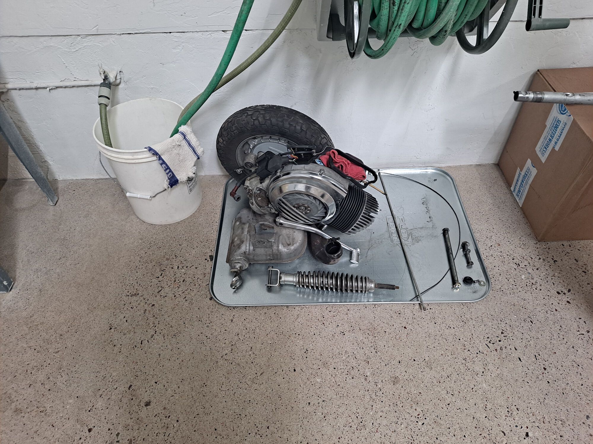 Motor out, and it's still in good shape.  It'll have to be rebuilt sometime in the not-so-distant future, but that's a future problem.  At least now it has a new cosa clutch and upgraded ignition.