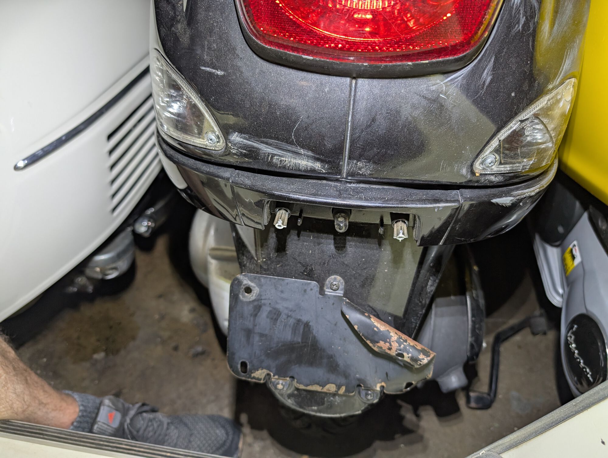 Broken license plate light cover