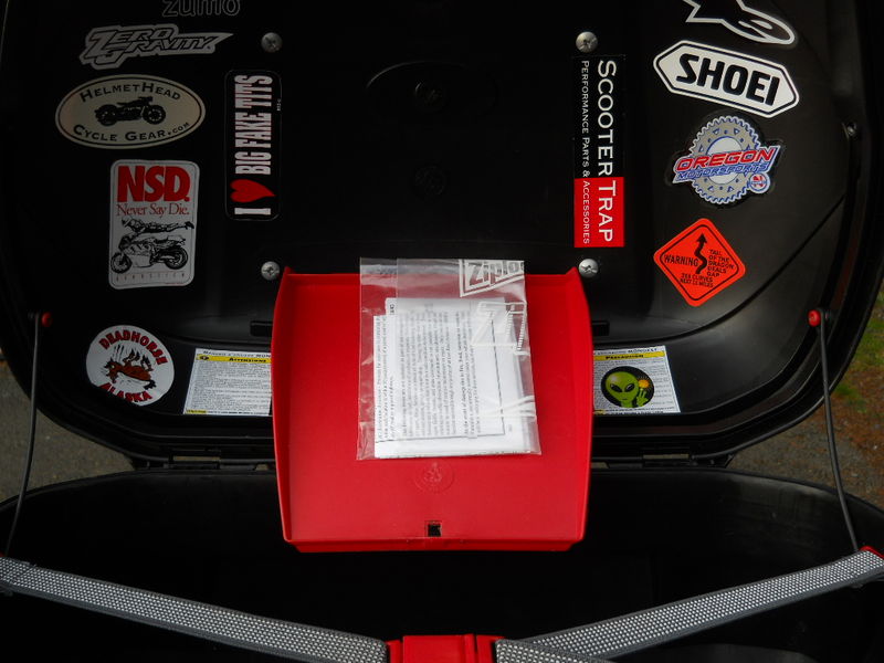 The compartment is just right for registration & insurance docs. Who knows why Givi doesn't include a knob with this box?