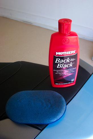 Mother's Back to Black. Remarkable stuff.  'Waxes', cleans and shines anything black or plastic and won't harm body