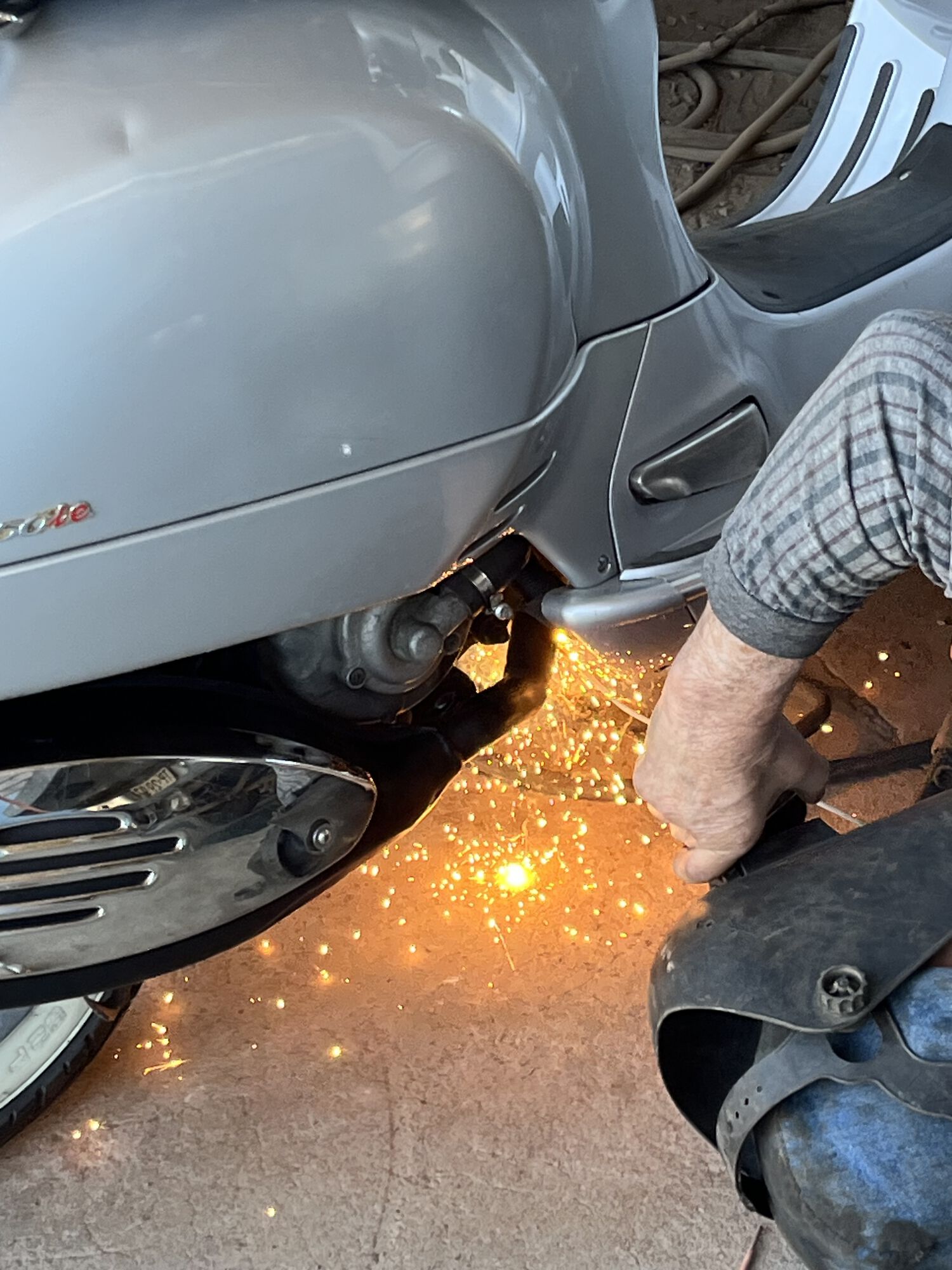 The scariest moment… him welding at 3 points with the muffler ON the bike