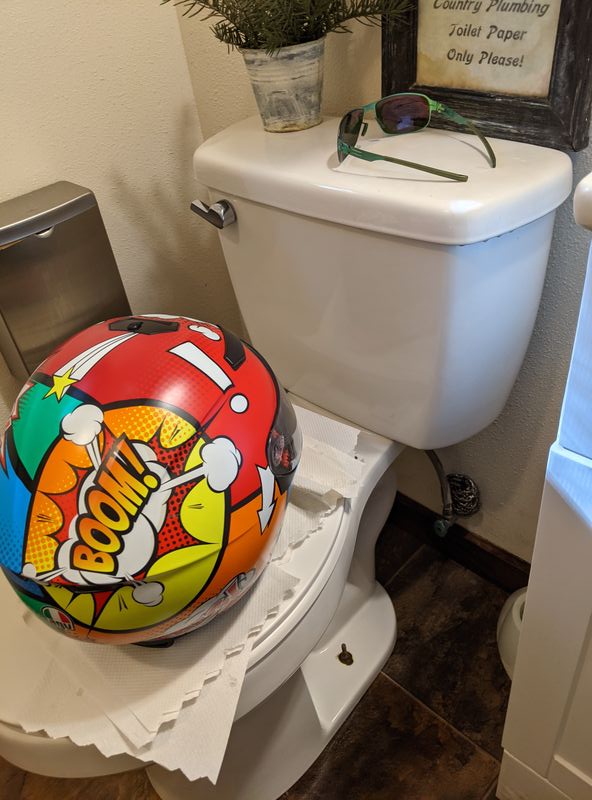 Makeshift table to hold the helmet in a tiny bathroom, while trying not to touch anything during coronavirus