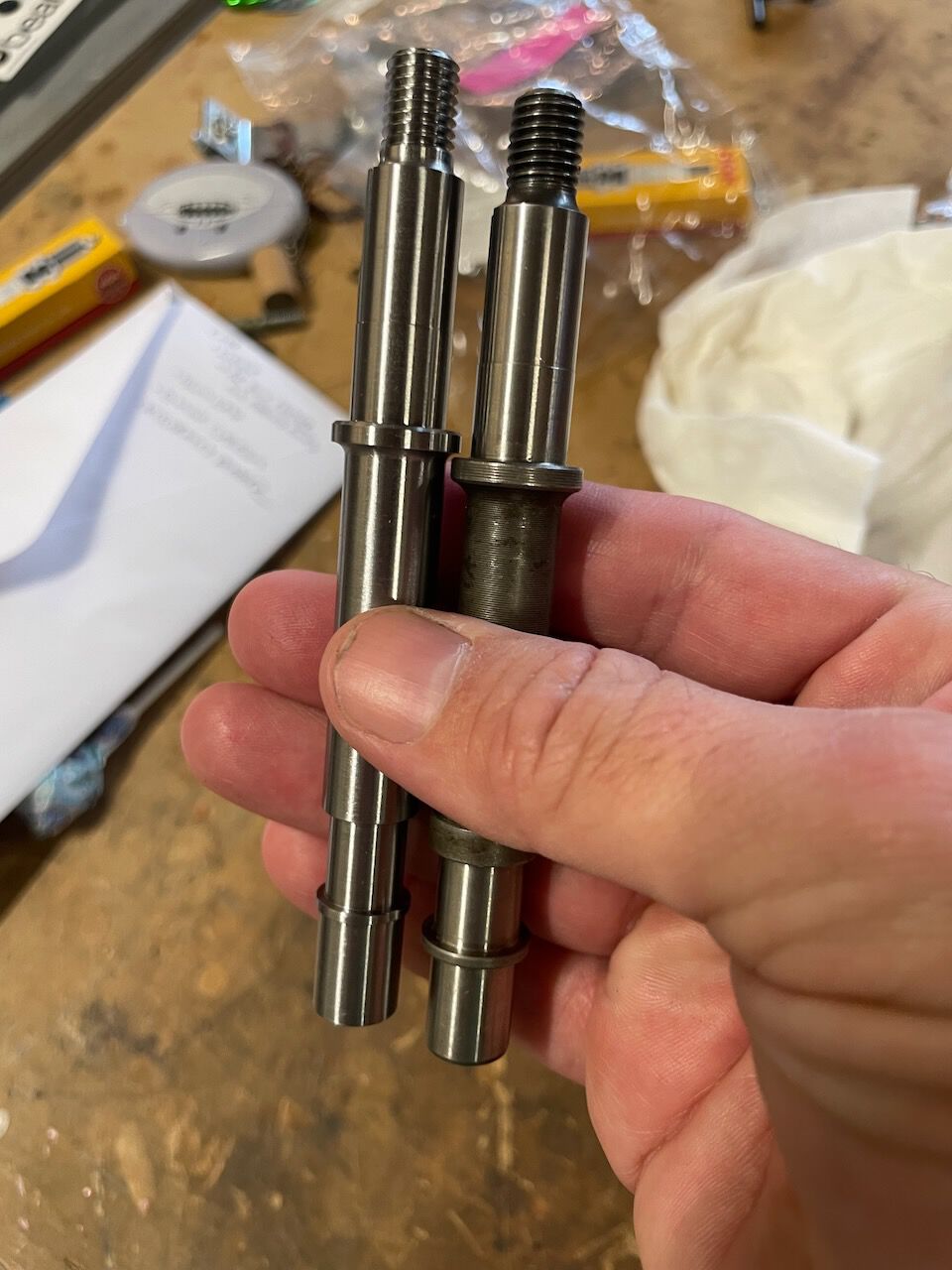 Custom spindle on left, P125X or P200e spindle on right.