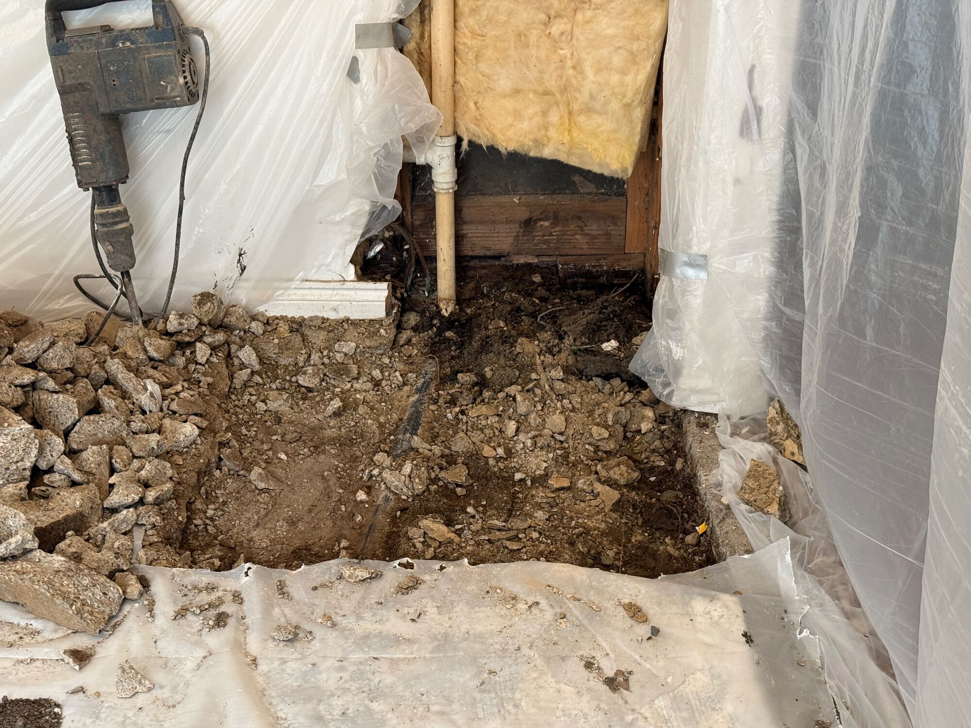 Concrete floor/slab removed. Excavation crew is on lunch break. The leak was coming from the back corner of that short wall.