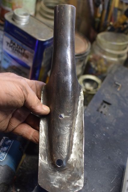 drill holes, wire brush off rust.