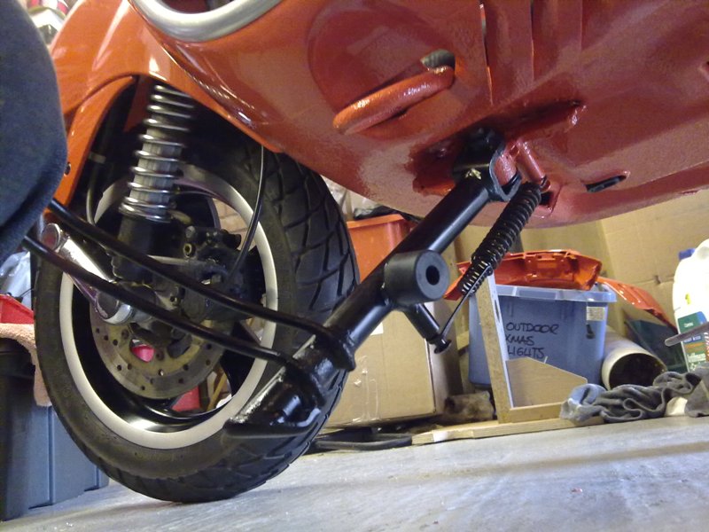 To finally celebrate a leak free bike I lay on the floor and fitted the side stand. Pack the shaft with clear grease on assembly.