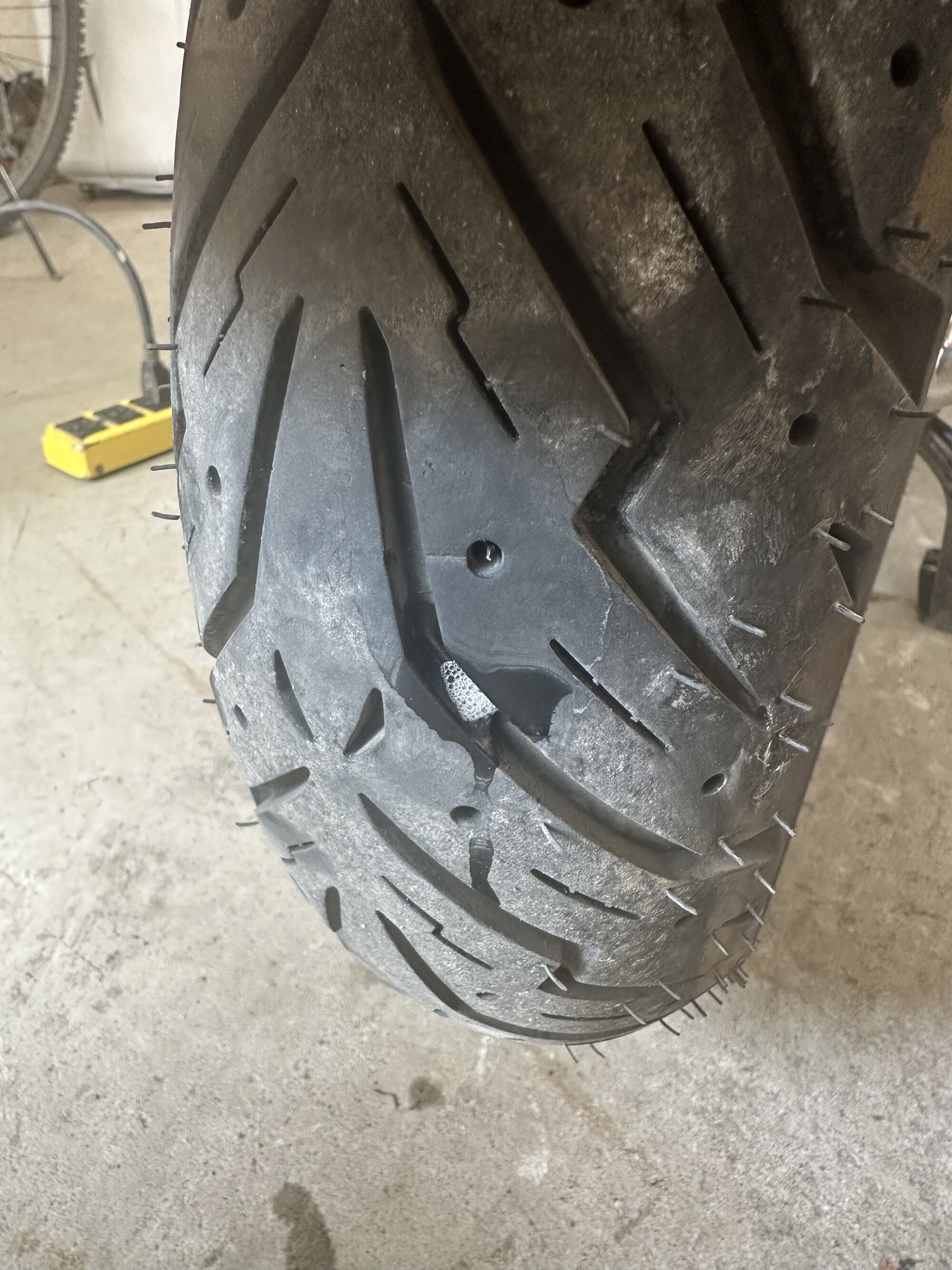 staple in rear tire.