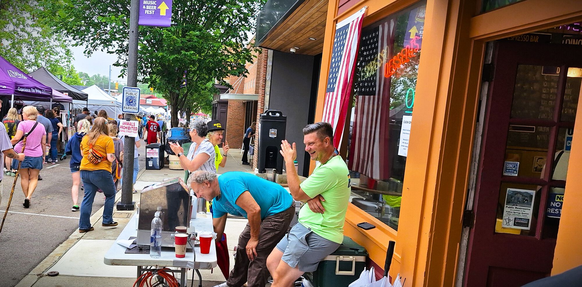 Dino (blue T) barking his products for the Yak Lady. One could hear these two  from the hotel!
Next door is Chappelle's new 2 story construction  (shop & 2 apts?)