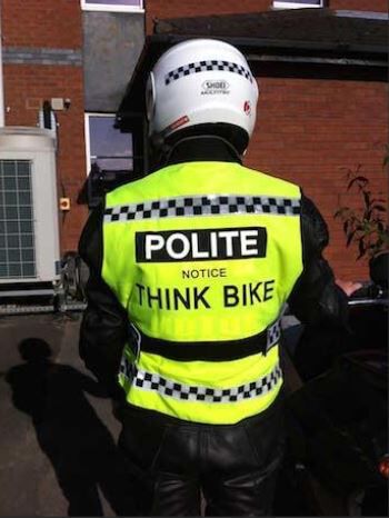 wore one of these POLITE vests this morning over all black ICON leather. I don't ride w/o hi viz.