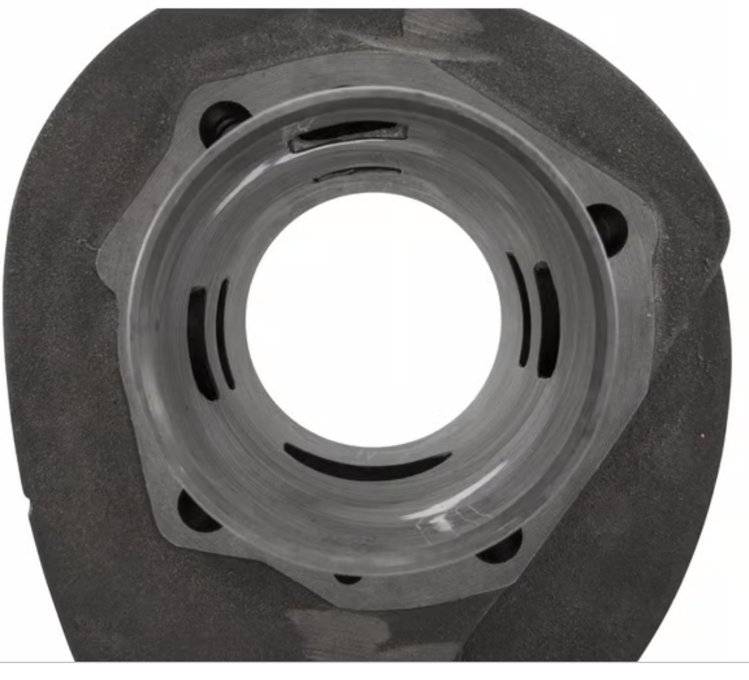 Stock Cylinder: note the unequal spacing between the edges of the exhaust port and the edges of the main transfer ports.