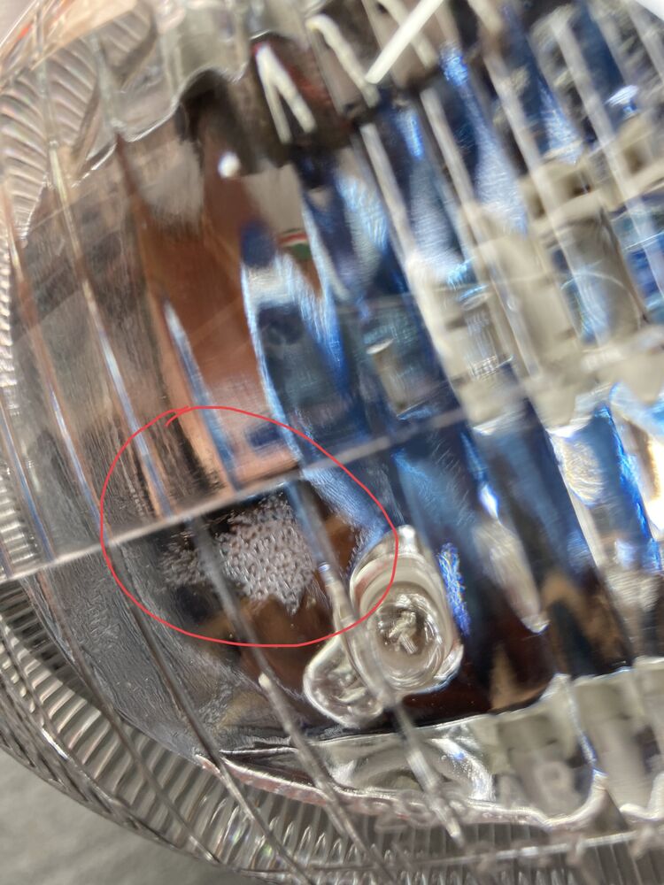 Poor finish on parabolic reflector around the side light.