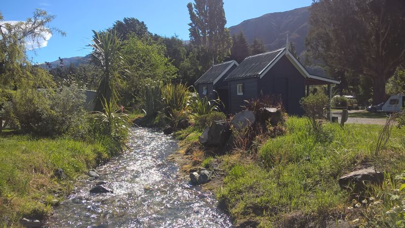 Cooling off the alcopops in the stream at campsite in Kingston