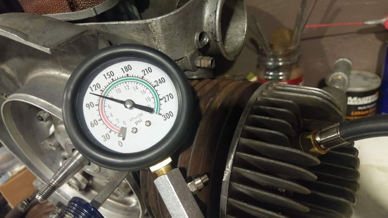Vespa spark test and compression test setup on scooter engine