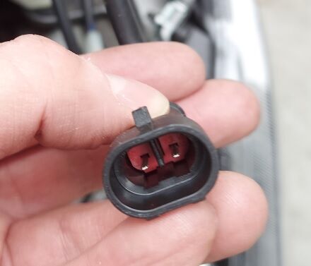 Wiring harness connector leading to the USB plug produced 12V