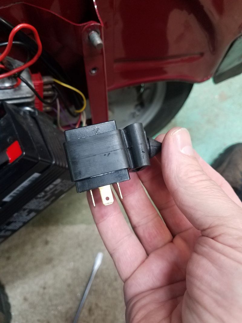 This is the temporary LED relay (doesn't drive the dash light). I have it in the original rubber holder, and it's easier to remover the relay and holder together.