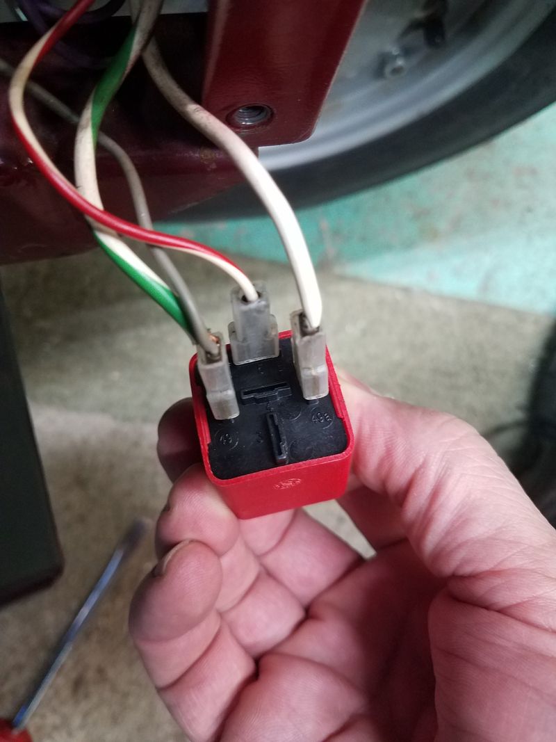 Relay wired up. From left to right, Power (2 wires), Pilot (or dash), Blinkers (L)