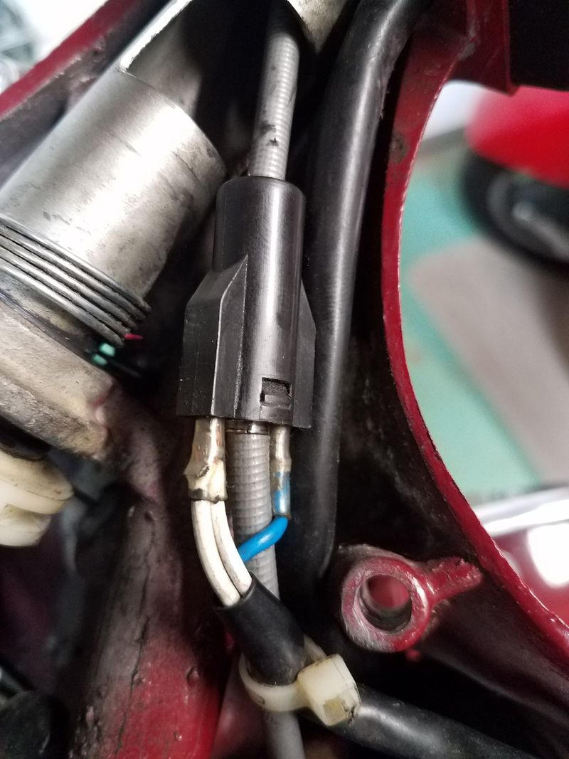 Plastic doohickey that runs the brake light.