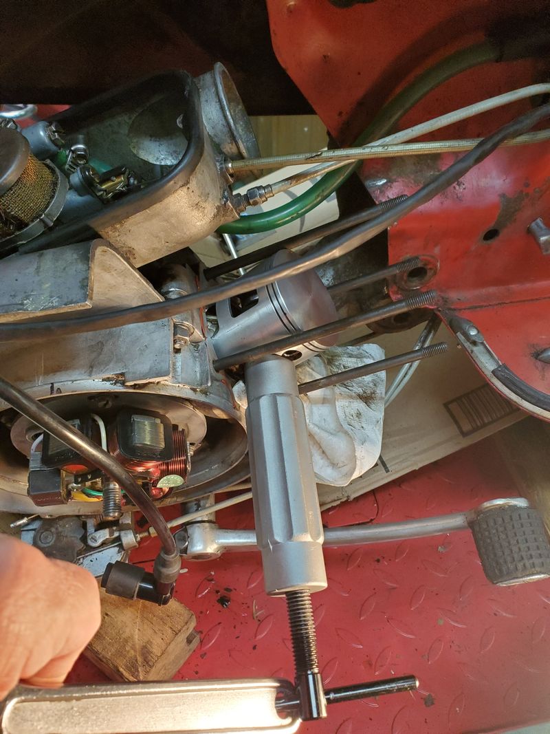 Using the fancy tool on the wrist pin to get it out of there without destroying everything.