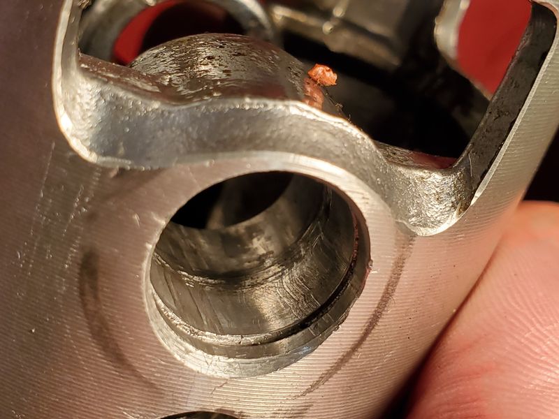 The outer edge of the piston scoring. I've never seen this before. What could cause this and does this mean a new piston and crank?