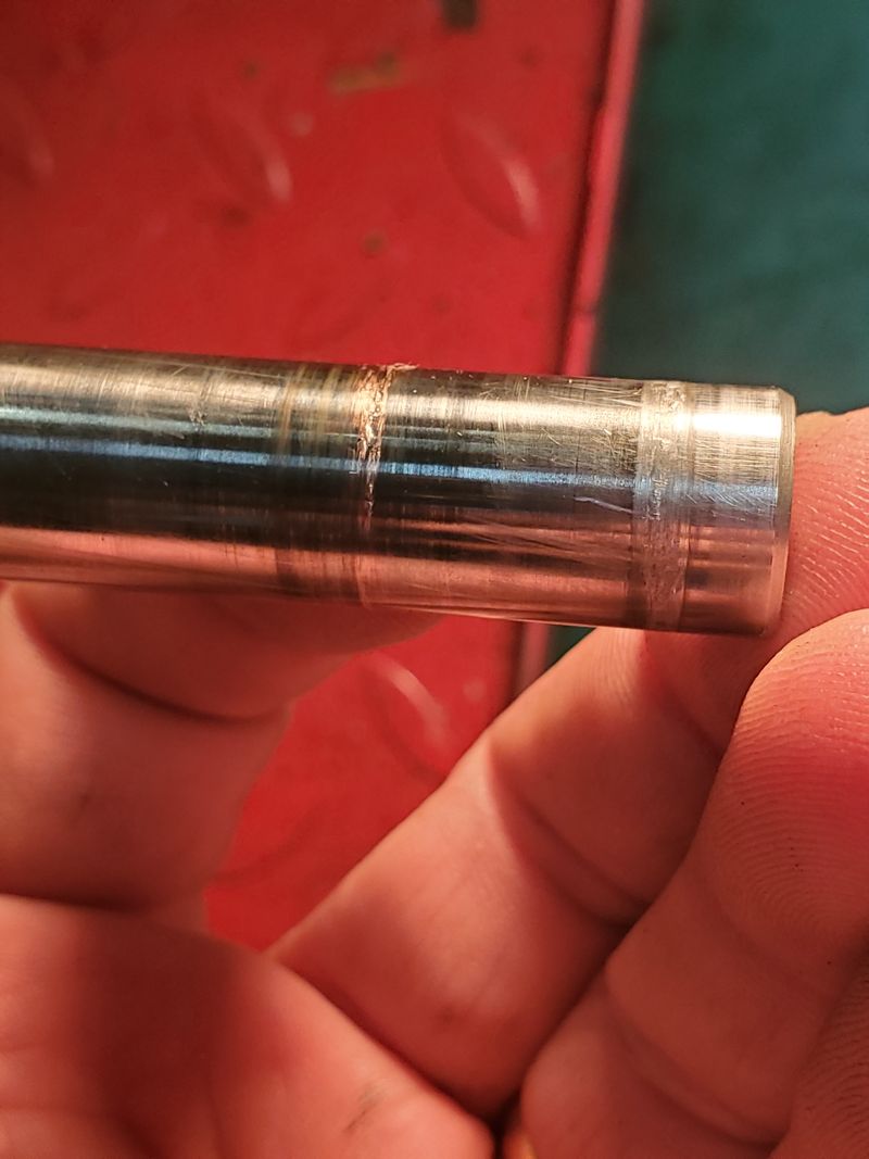 Wrist Pin scoring. The outer scoring is from the outer side of the piston