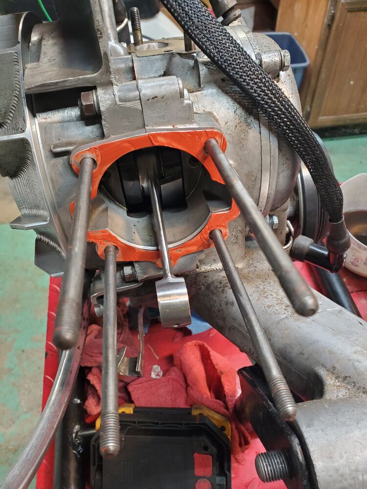 Spooged up base gasket with RTV. Time to install the piston, then slide on the cylinder...