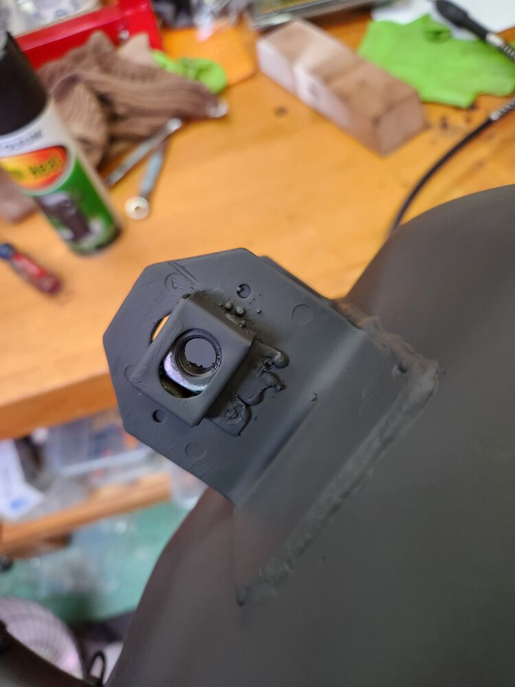 Nut and cage down at least 3/8 of an inch, welded, and painted