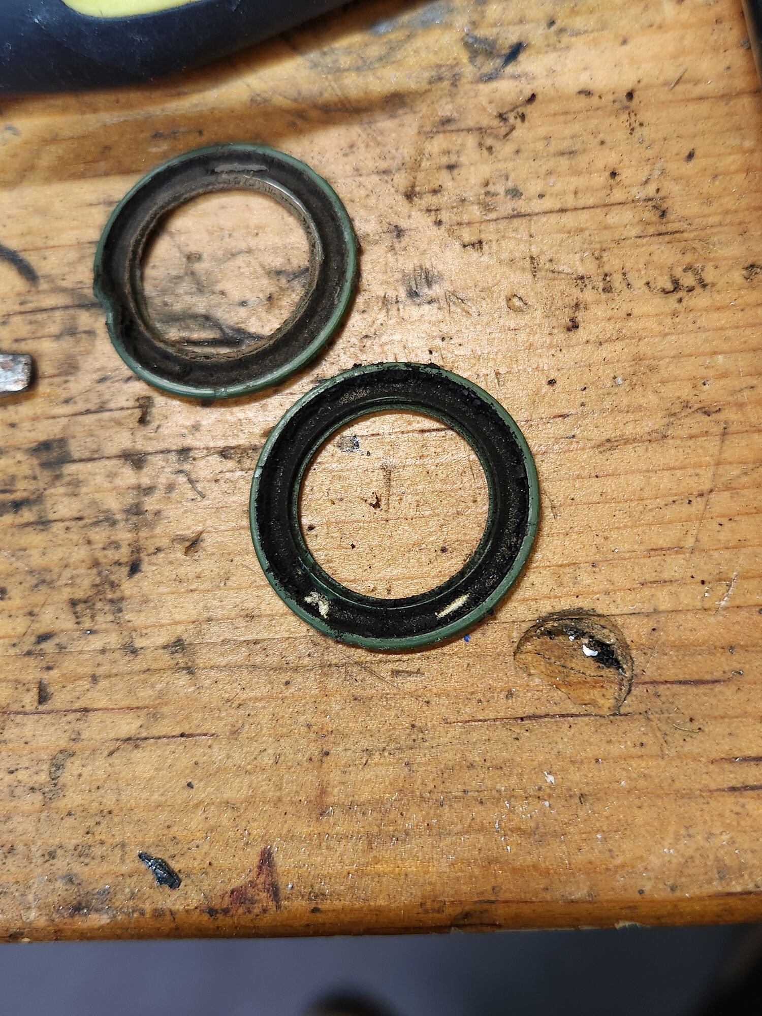 The dust caps on these bearings are super black, and so were the bearings. Sawdust and grease ...