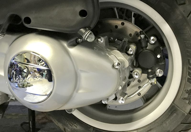 Those chrome bolt covers look eh...Maybe just change the bolts to polished stainless from Scooterwest.