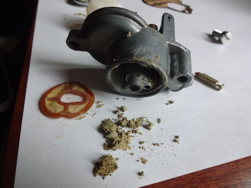 Crud removed from float bowl assembly after 4000 miles.