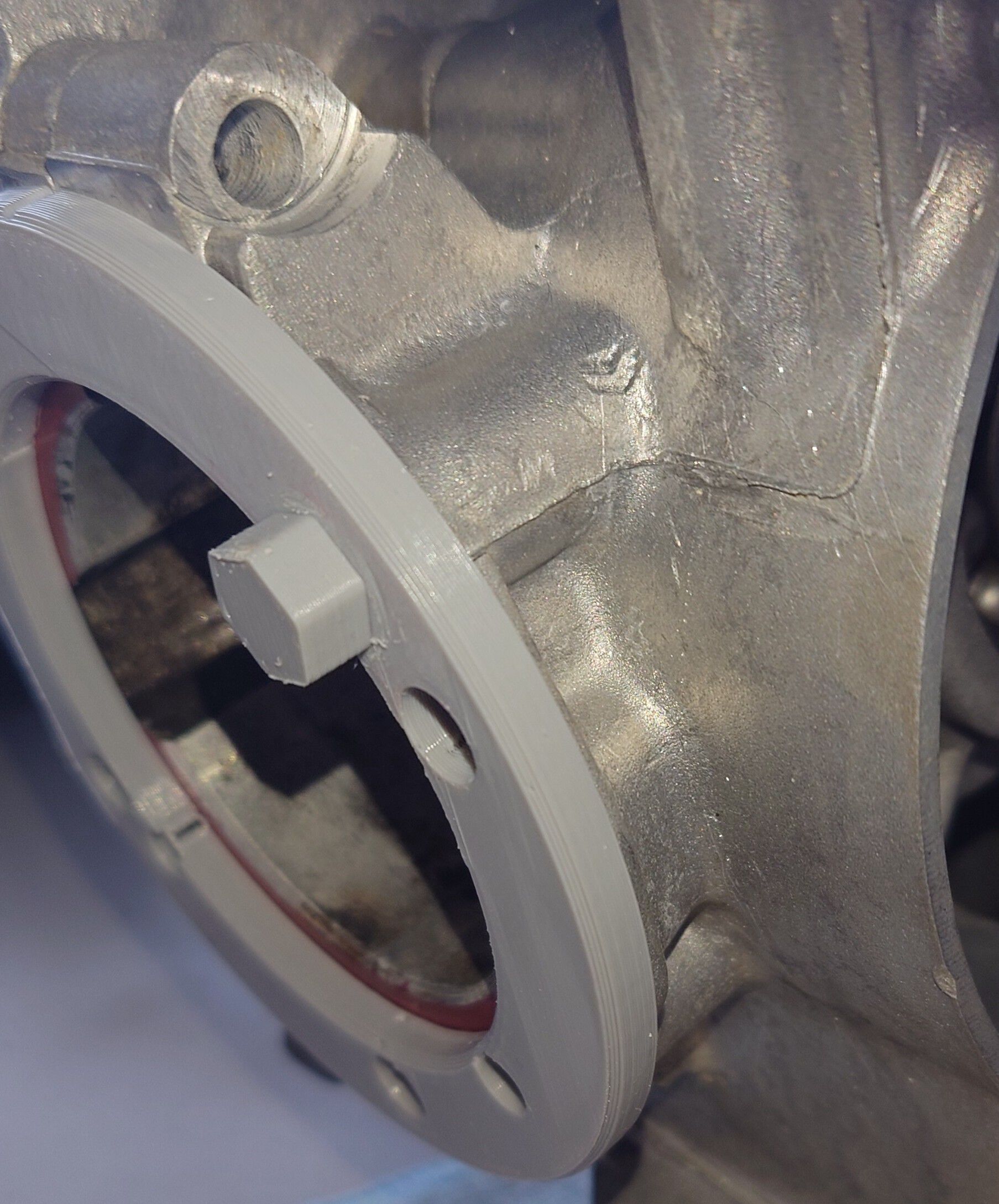 In this photo, you can see the mock-up of the Explorer cylinder mounting surface, sitting against the crankcases. The area under the mount flange is evidently missing material required to mate the Explorer with the smaller largeframe cases.