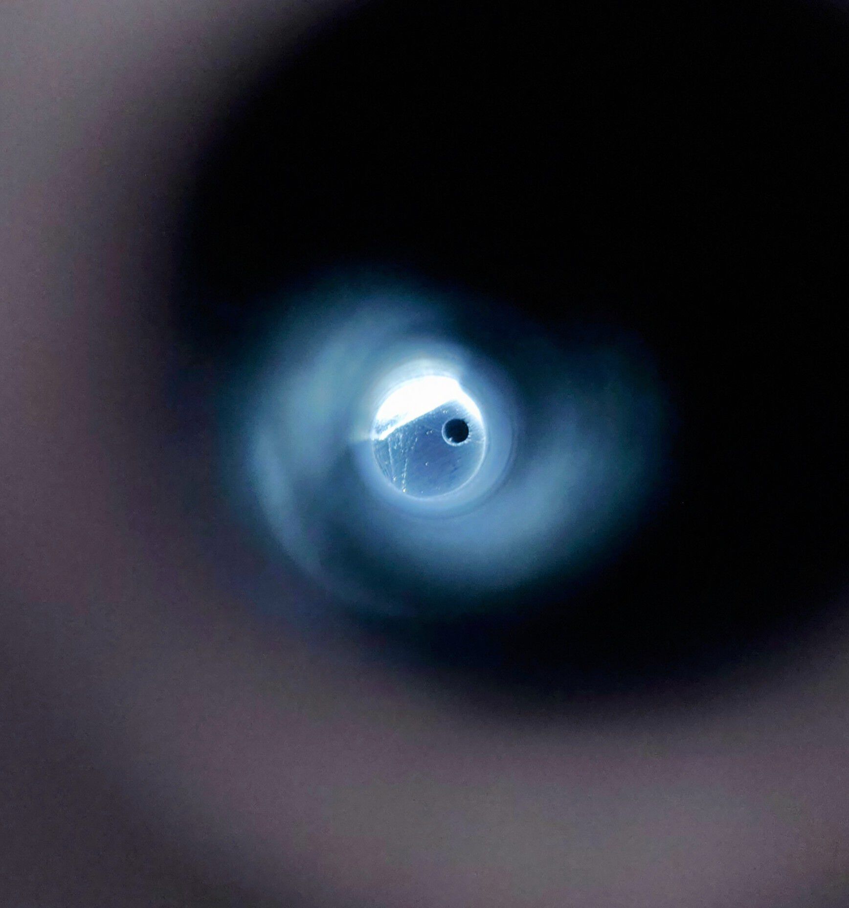 A shot down the stud hole. This is how much off it is in comparison to claimed position. The pilot hole shows expected centre.