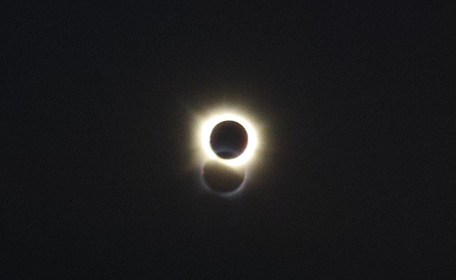 Sometimes it pays off to have a moving office, you can just move to a location where the totality is visible.
Dual halo is a result of standing behind a double glass window.
