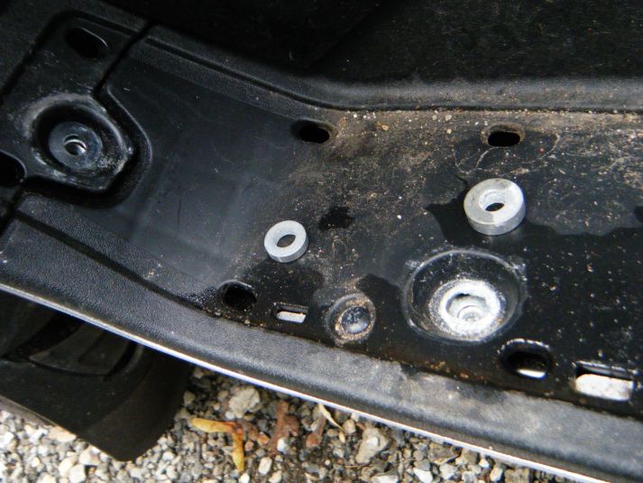 Spacers removed from their wells. The front one is at an angle and has an annoying habit of sliding out when the screw is not holding it.