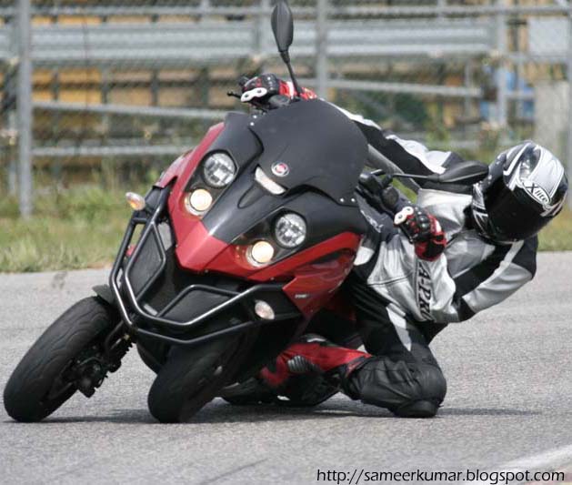 Maximum lean, maximum strut compression - check out where the left tire is relative to the wheel well.
