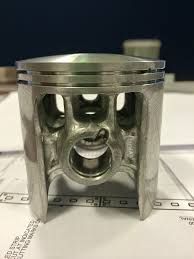 modified malossi piston, but they missed the bit at the bottom of the skirt of the side passage.