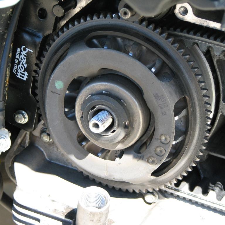 Engaged with the variator holding tool. I reviewed the pics and ensured that the outer pulley, and the starter gear back on in the same orientation. Note the arrows on the gear. There were some similar marks on the pulley as well. Balance.