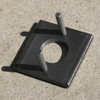 Made from two bolts, and some sort of construction washer.