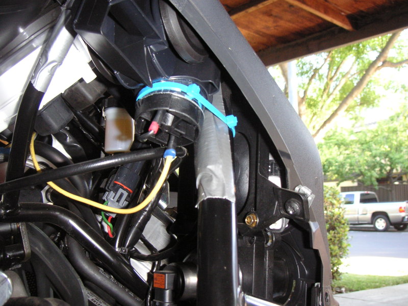 Horn cable tied to frame with a piece of duct tape covering a piece of nylon strapping to protect the frame. Thanks to Lex500 for this idea.
