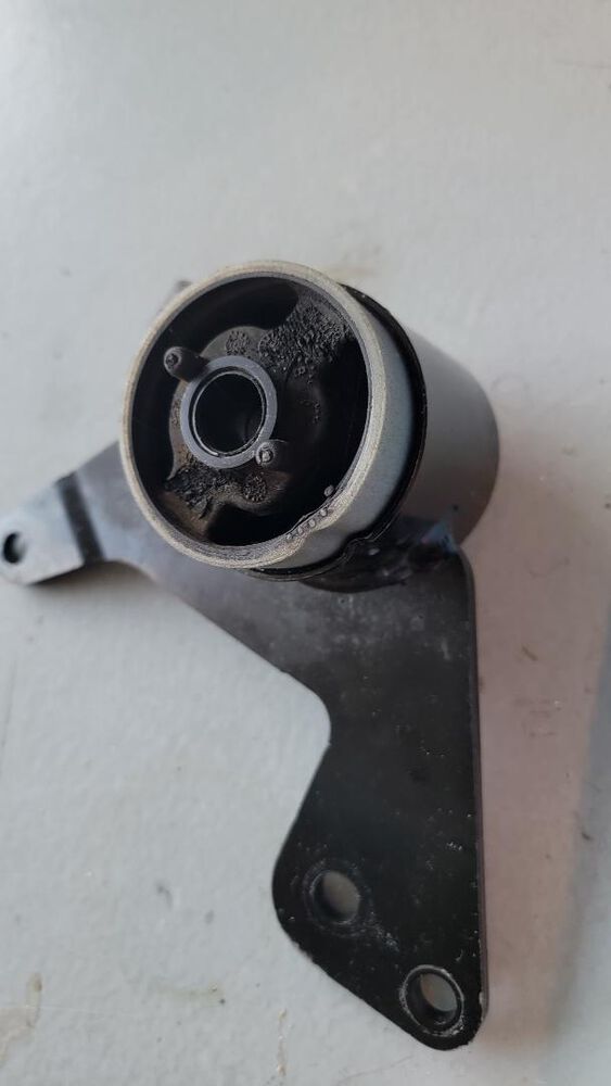 Old original Silent Block.  Not cracked and slides in with limited pressure.