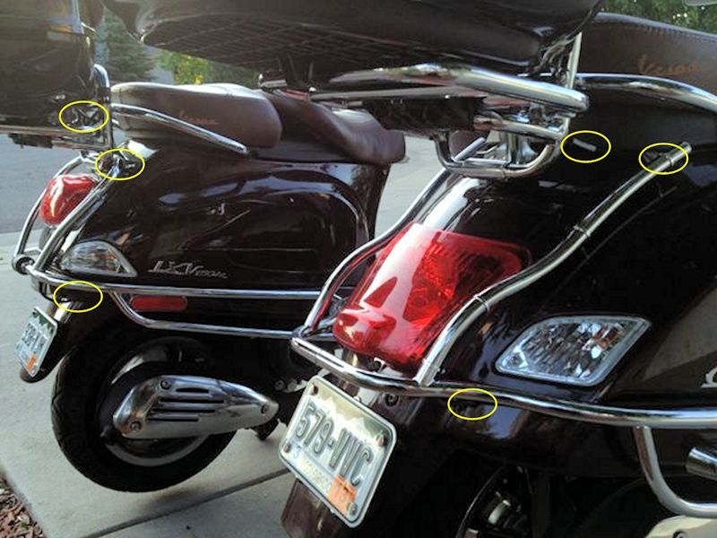 Points highlighted are where the wire is gently coiled and zip tied behind the top box (LXV on left), then follows the crash bar down near the right rear skirt.  Hole bored through the skirt passes wire through to join the bundle just inside.