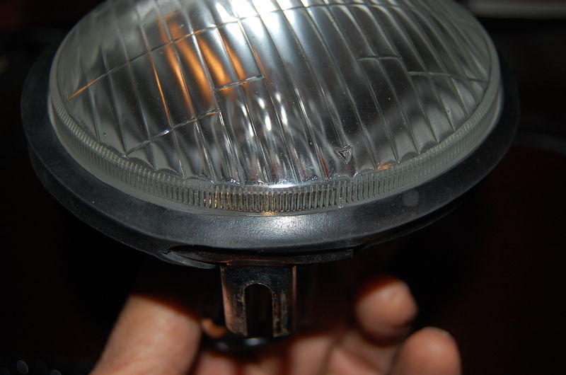 Arrow on glass doesn't line up with bottom mounting tab, so headlight looks cockeyed when on bike.  Can't have that.