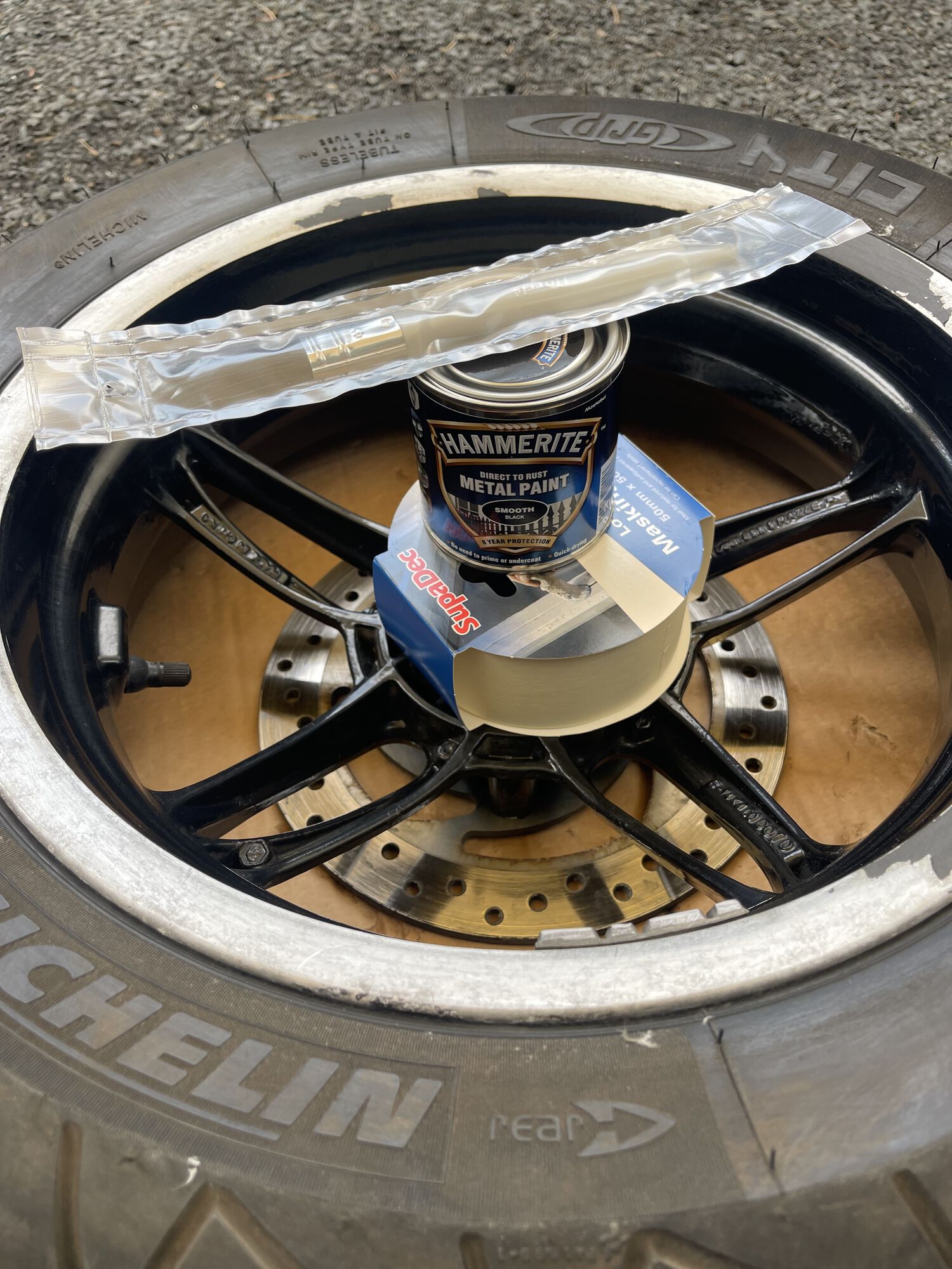 The rear wheel of my BV350 sanded and ready to attack with some hammerite!