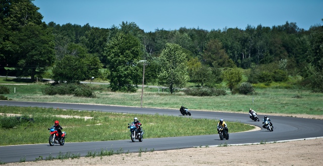 I'm at the far right exiting turn 10 (behind the instructor in the yellow).  One of the best riders in the group was the woman out front on the red G650GS--and she's only been riding a few months.