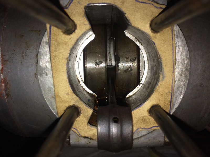 LOTS of CRC/WD40, & wiping with a rag on a stick makes it cleaner.
Debris will come out with oil change
Plus new base gasket