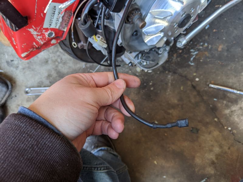 stock ht coil connection coming from stock cdi on the battery side.  This will stay as a spare wire not connected to anything now.