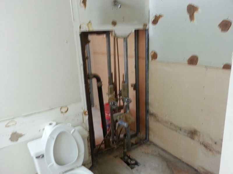 One bath back to back with other...took out wall to inspect plumbing.