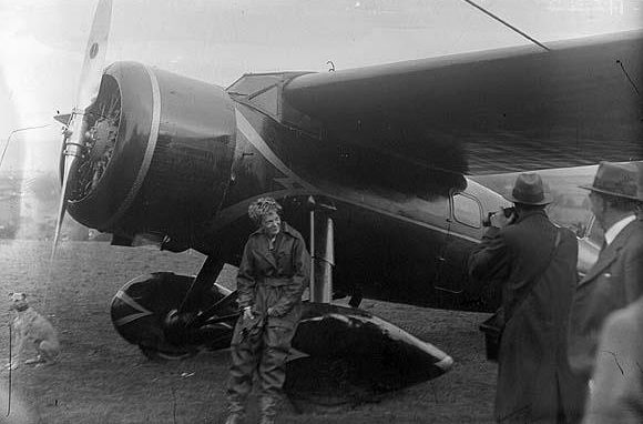Amelia Earhart with her Lockheed Vega 5b, NR7952, at Culmore, North Ireland after her solo transatlantic flight, 21 May 1932. (National Library of Ireland)