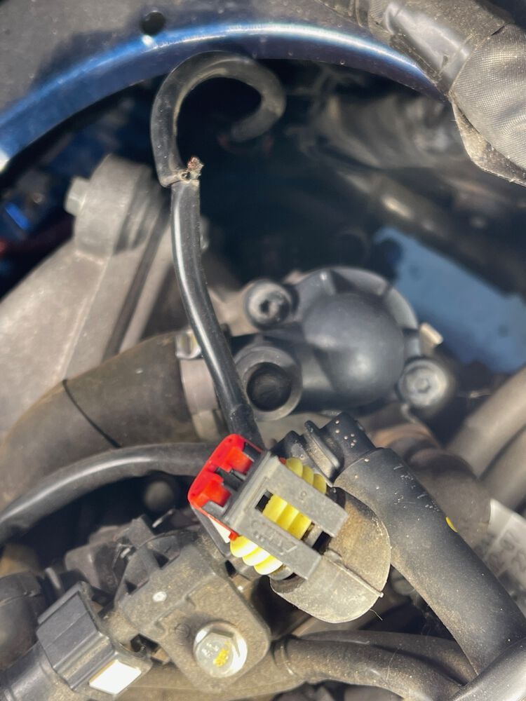 H. V. coil wire was pinched