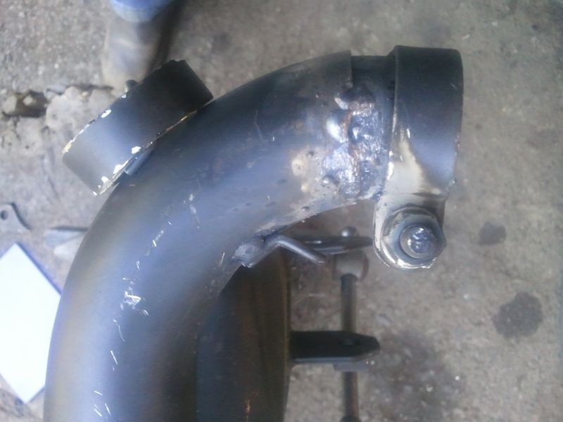 you can see the slight angle from tipping the front of the header up almost tight to the spring
the piece I cut out is hanging on the spring loop