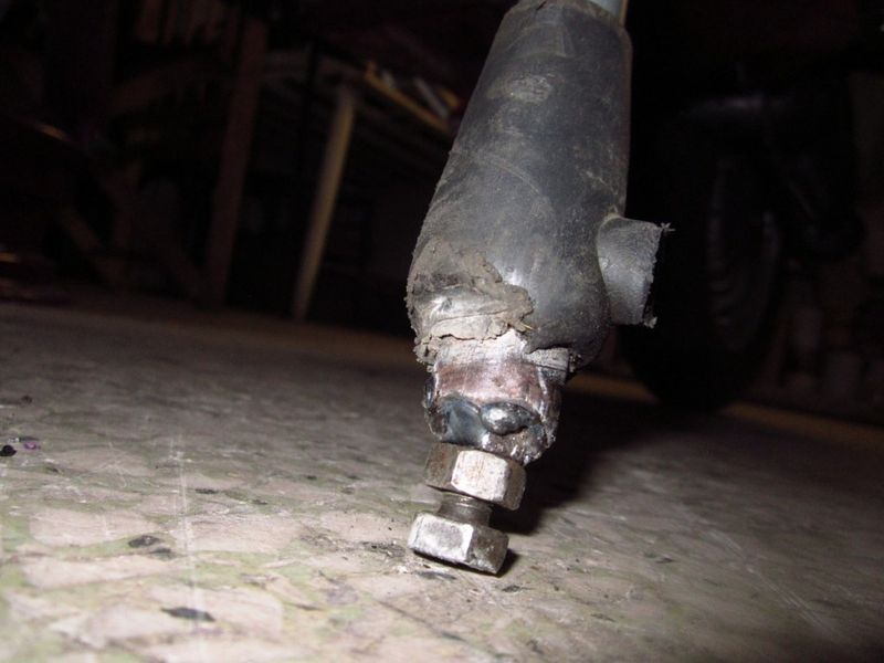 the bigger tires needed the center stand extended
I welded nuts in the ends of the tube, then bolt w/ jamnut
slide down worn out booty & it's all covered